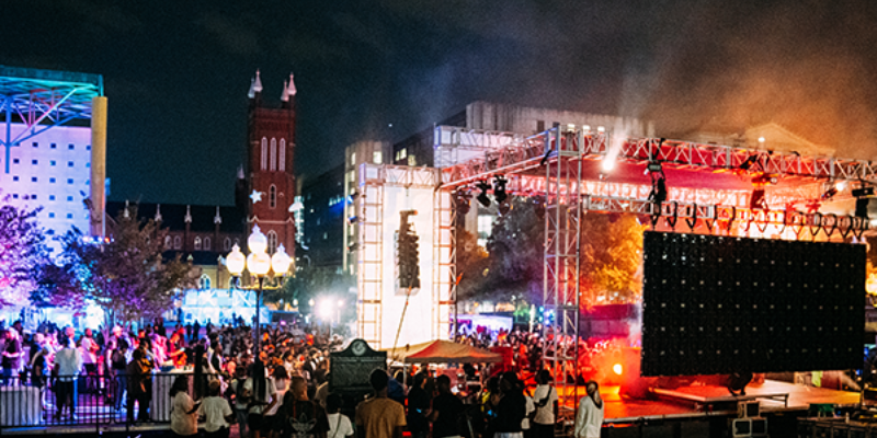 Georgia Freight Depot during Destination Atlanta with stage, crows, and VIP area in scene