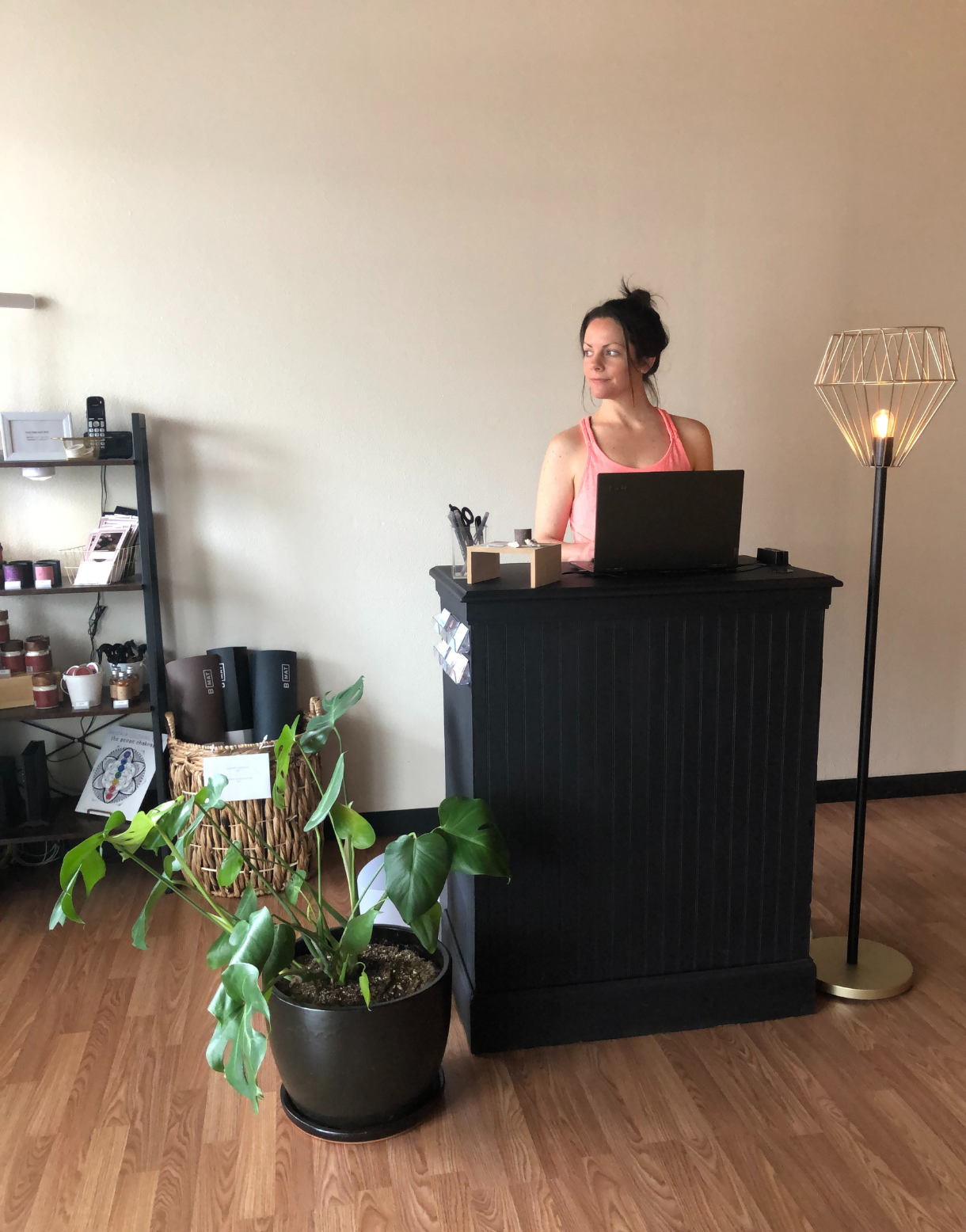 Kove Yoga studio front desk with plants, retail items, and a calm, minimalist interior.